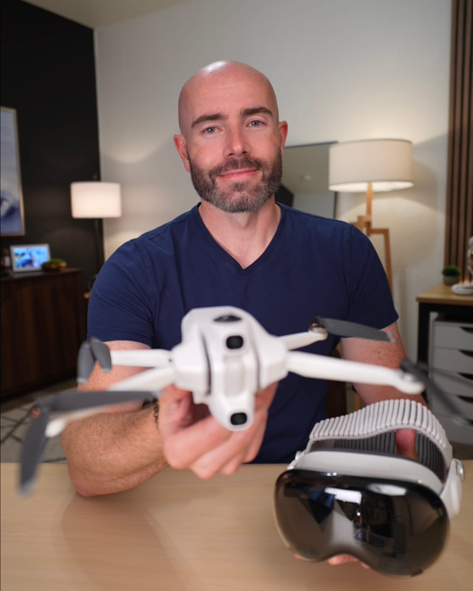Justin Ryan holding a 360 drone during a hands-on review